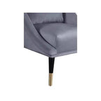 Fauteuil d'appoint en velours avec pieds en bois noir et embouts dorés, design contemporain